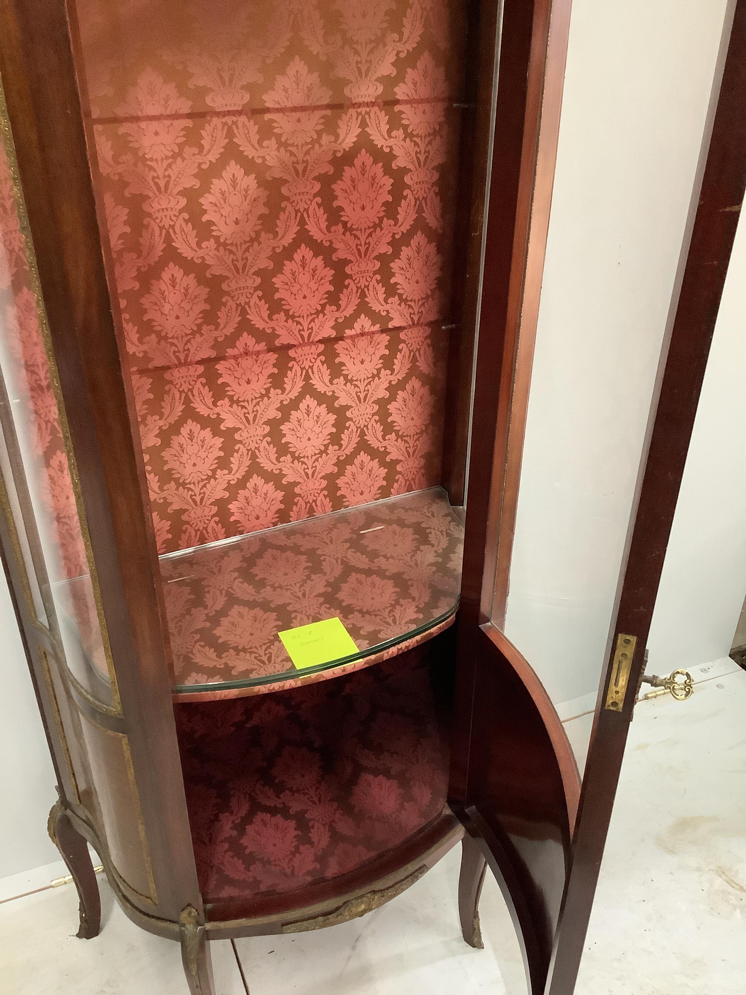 A Louis XVI style gilt metal mounted marquetry vitrine, width 67cm, depth 35cm, height 167cm